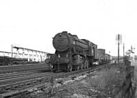 32BKH ‘War Department’ 90556, mixed freight on the Bury line.  B K Hilton.